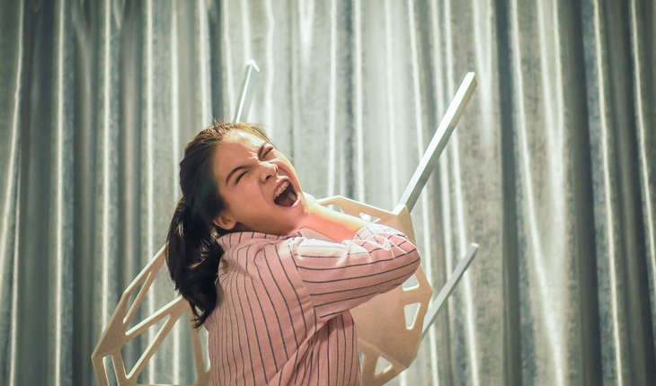 angry-woman-throwing-chair