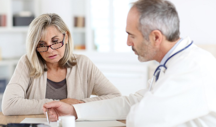 Mature woman consulting with doctor
