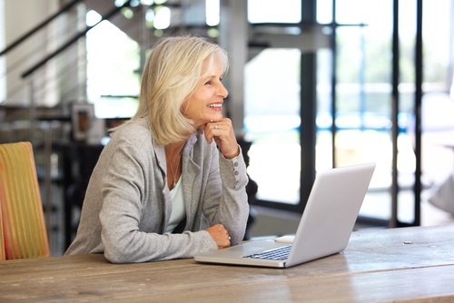Mature woman with computer