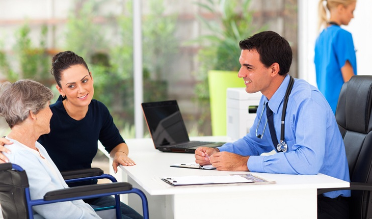 Mother and daughter with doctor