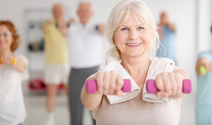 older-woman-exercising-in-class