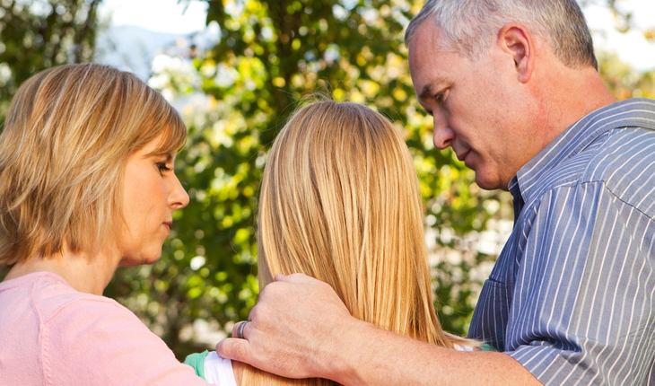 Parents with sad child