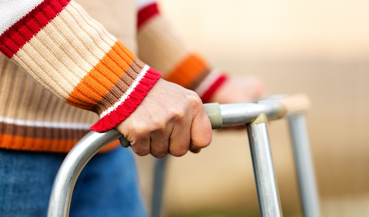 Senior woman using walker