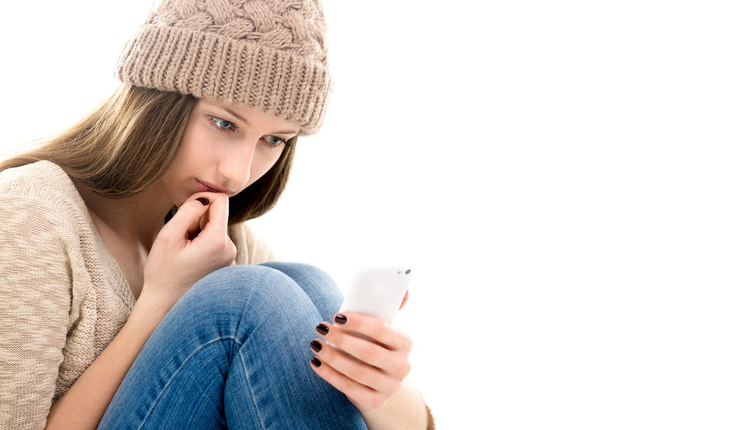 teenage-looking-at-smartphone