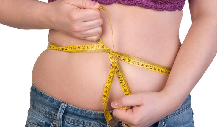 woman-measuring-belly-fat