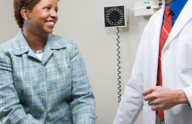 black woman with doctor