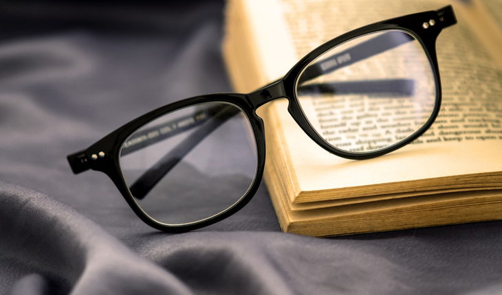 Eyeglasses and book