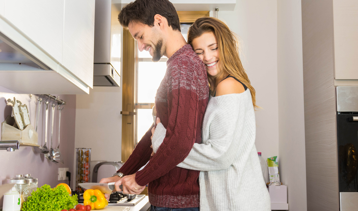 couple-cooking-and-hugging