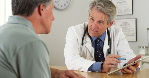 doctor talking with male patient