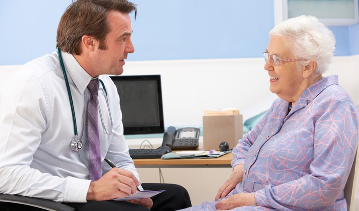 doctor talking with woman patient