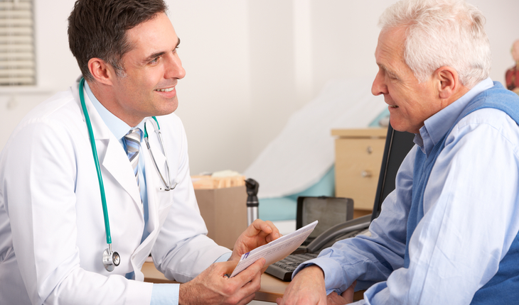 doctor meeting with older male patient