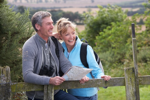 happy older couple hiking
