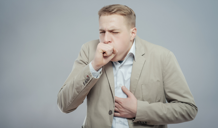 man coughing