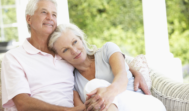 mature couple at home on porch