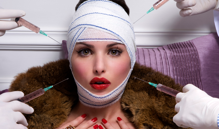 young women with medical bandage and a fur-coat having a injection