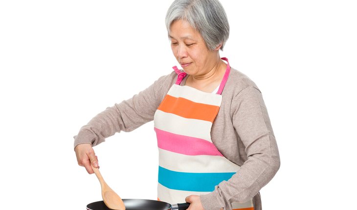 old woman cooking
