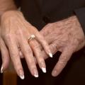 older hands with wedding rings
