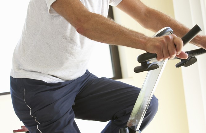 senior man, exercise bike