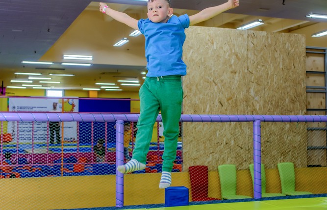 Child jumping on trampoline