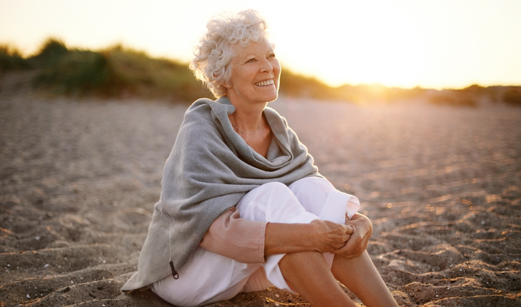 woman sitting on beach