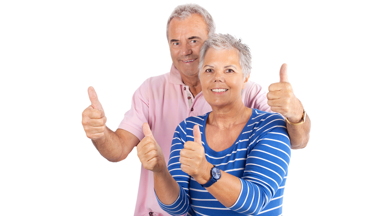 older couple giving thumbs up