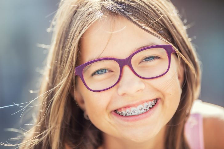 Girl with braces and glasses