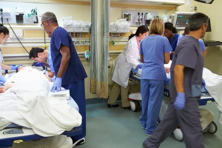 medical personnel working in emergency room