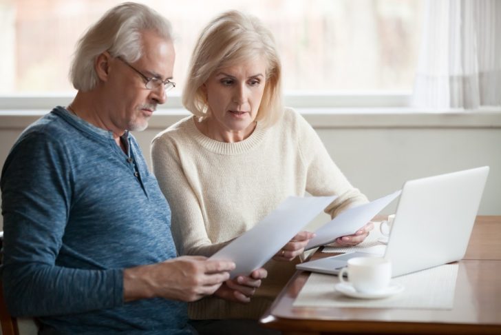 senior-couple-worried-about-finances on laptop