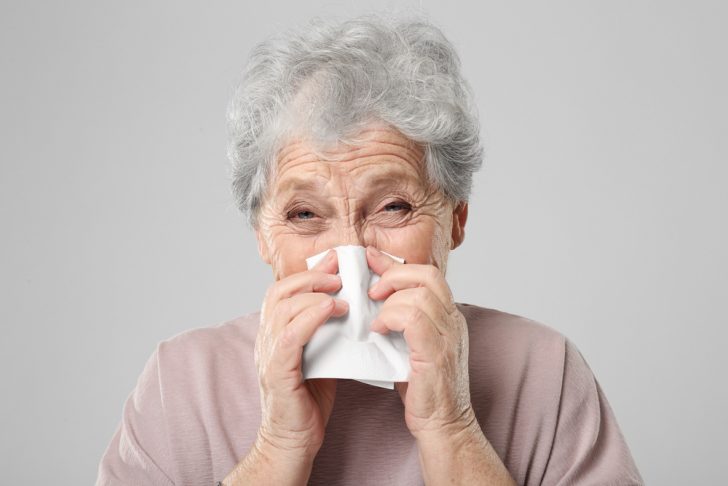 elderly woman with cold or flu
