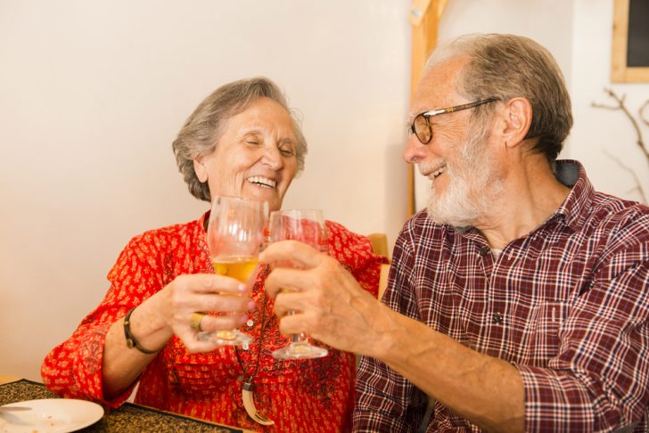older couple drinking wine