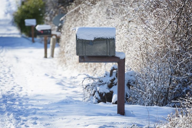 show covered road with mailboxes